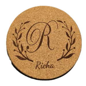 Personalized round cork coaster with engraved monogram initial and custom name