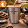 Personalized stainless steel cup engraved with Arthur in outdoor camping setting