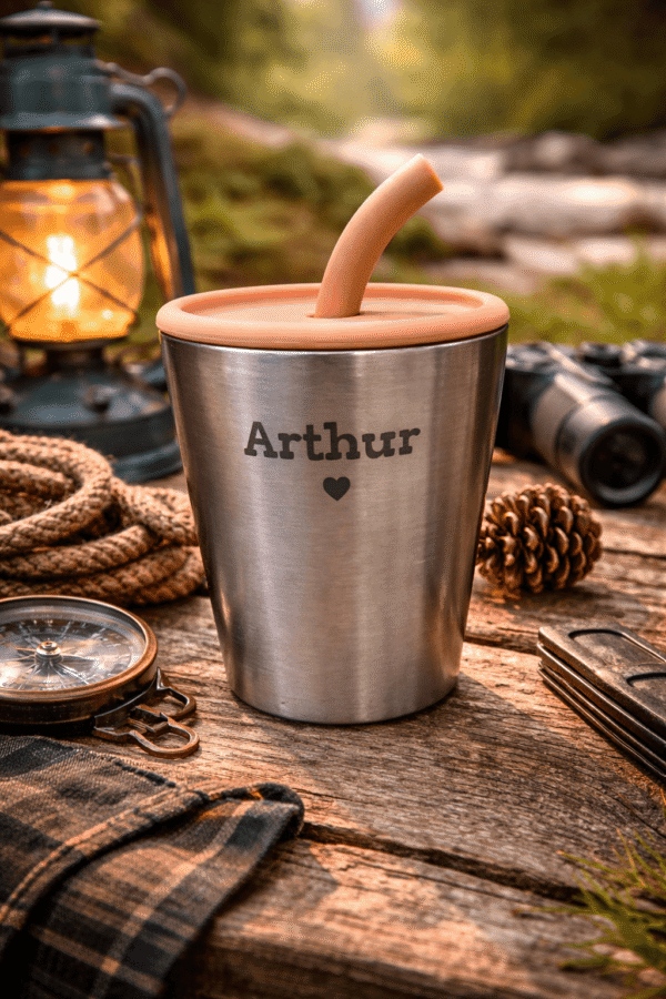 Personalized stainless steel cup engraved with Arthur in outdoor camping setting