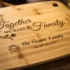 Close-up macro view of a personalised engraved bamboo chopping board showcasing detailed laser engraving with warm natural lighting and blurred background.
